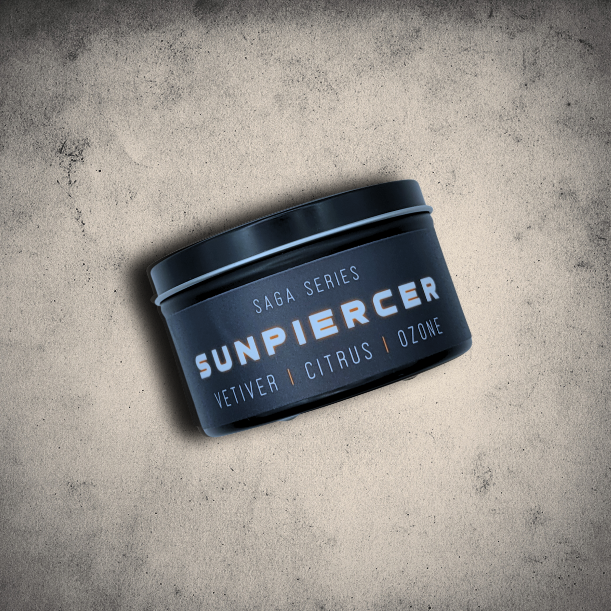 Emberlight Archives Sunpiercer candle in an 8oz black tin with black label against a gray stone background, Citrus scent.